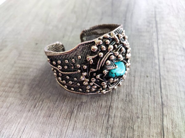 Turquoise accent in bronze