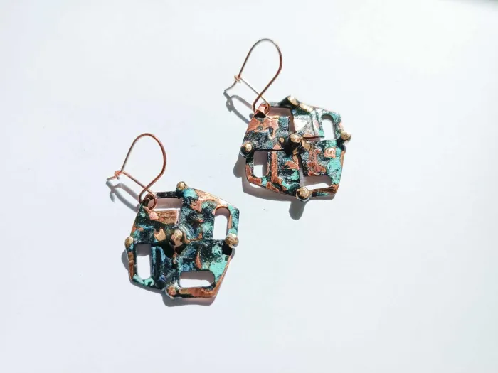 Aged copper crosses