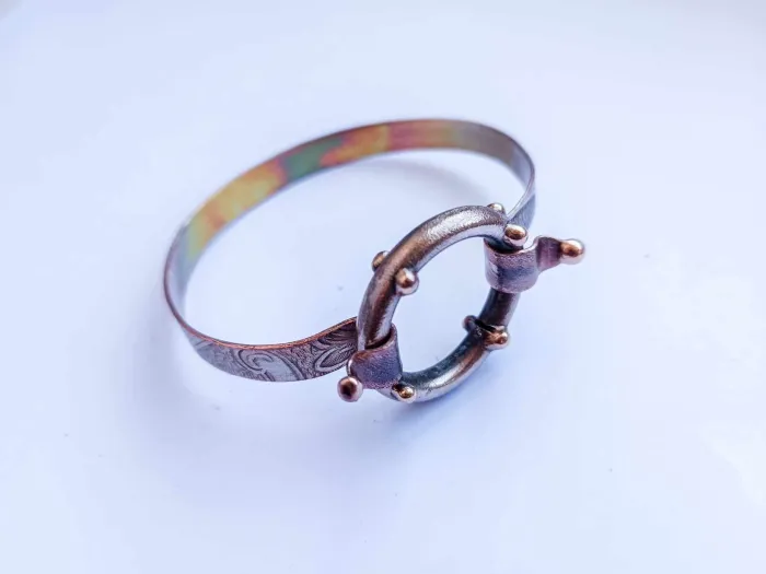 Silver-plated copper bracelet with a removable round ring