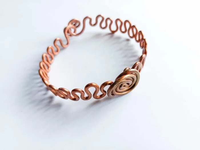 Twisted copper bracelets with a wave and circle of life in the center no. 1