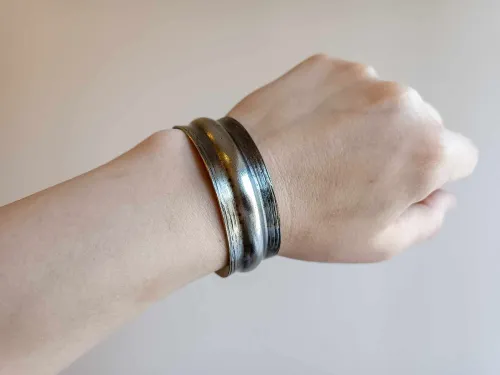 Wider and narrower brass bracelet